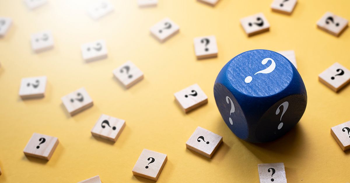 game pieces with question marks on them spread out on a table top