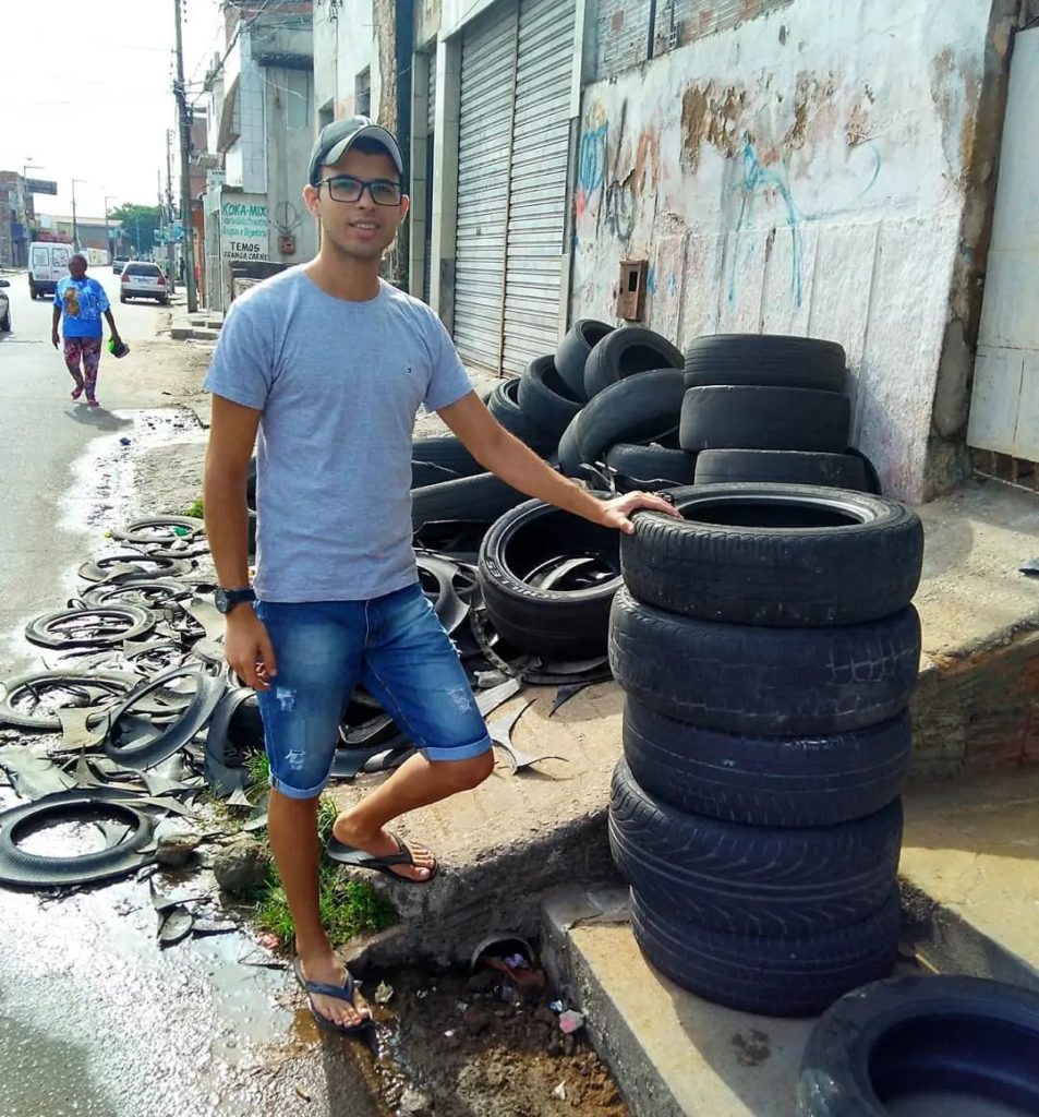 Amarildo Silva with a bunch of tires