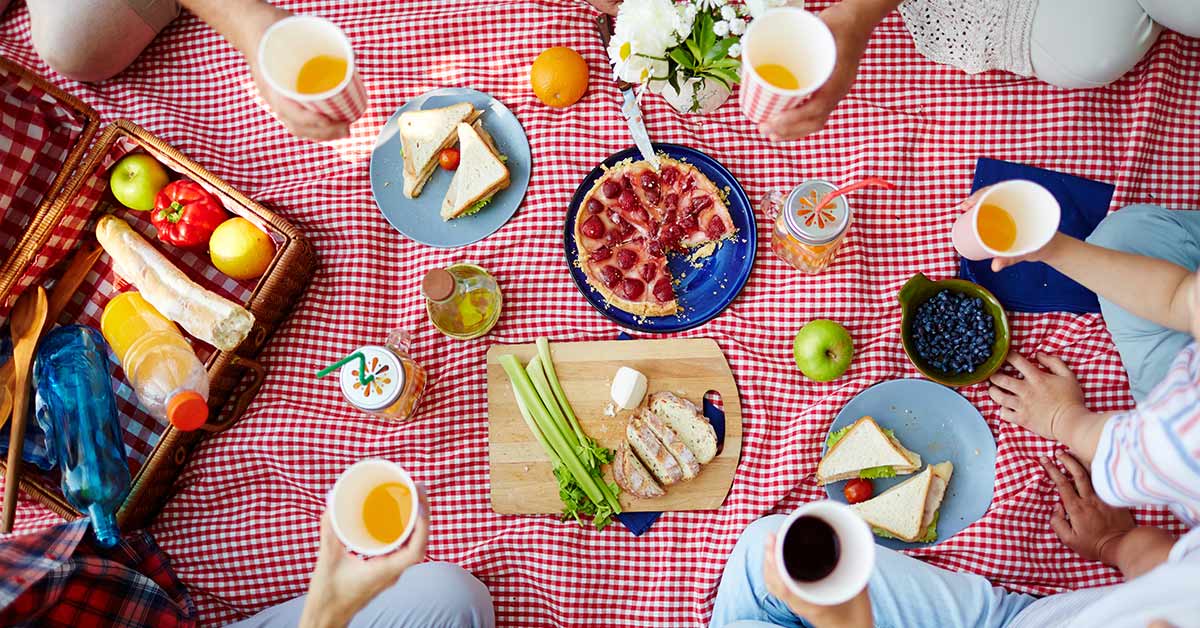 various foods on picnic blanket