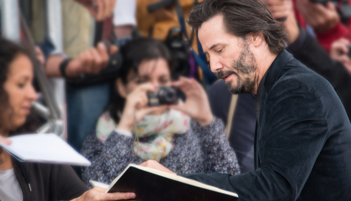 Keanu Reeves signing autographs 