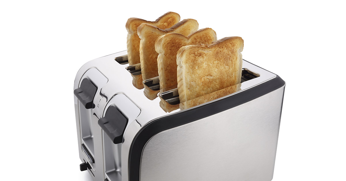 4 slot toaster with 4 slices of toasted bread popping out